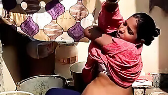 A Pregnant Indian Girl From A Rural Village Takes A Bath Outside