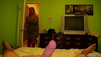 Aroused mom masturbating to a young man's penis