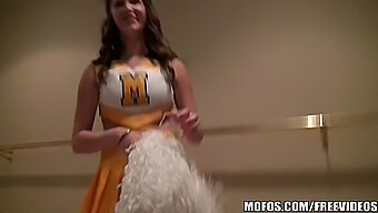 Holly, the cheerleader, flaunts her enthusiasm and big natural breasts